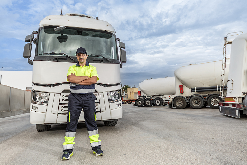 truck driver stands proudly beside his big rig 2026 03 24 07 56 34 utc